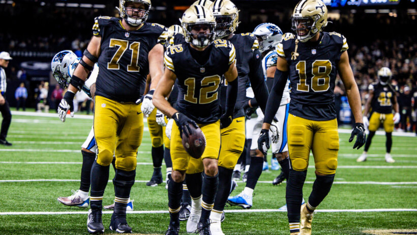 New Orleans Saints wide receiver Chris Olave (12) reacts to making a touchdown against Carolina Panthers