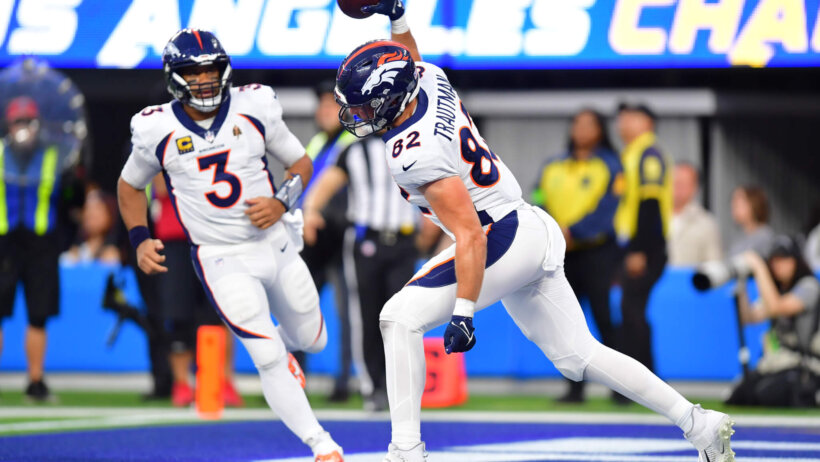 Denver Broncos tight end Adam Trautman (82) celebrates his touchdown