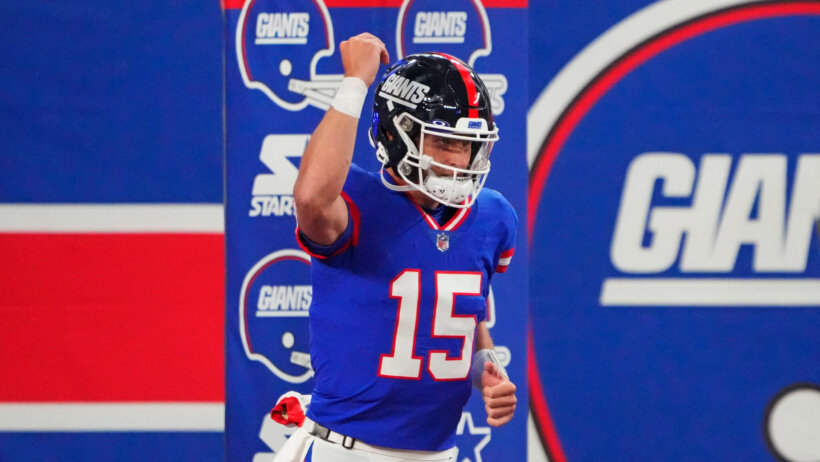 New York Giants quarterback Tommy DeVito (15) reacts before the game
