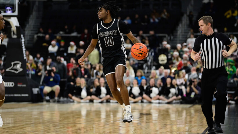 Brown Bears guard Kino Lilly Jr dribbling