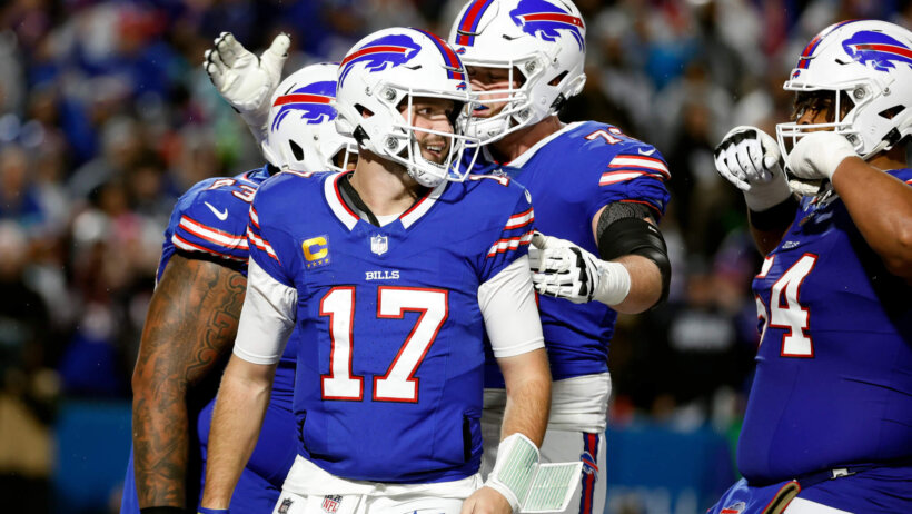 Josh Allen (17) celebrates his 1-yard touchdown run against the Cowboys.