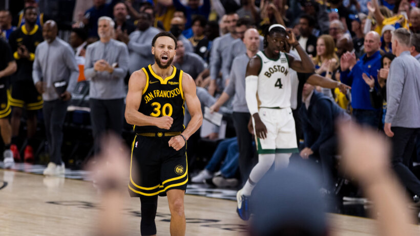 Golden State Warriors guard Stephen Curry celebrates hitting a three