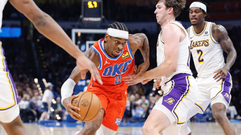Oklahoma City Thunder guard Shai Gilgeous-Alexander drives past Los Angeles Lakers guard Austin Reaves