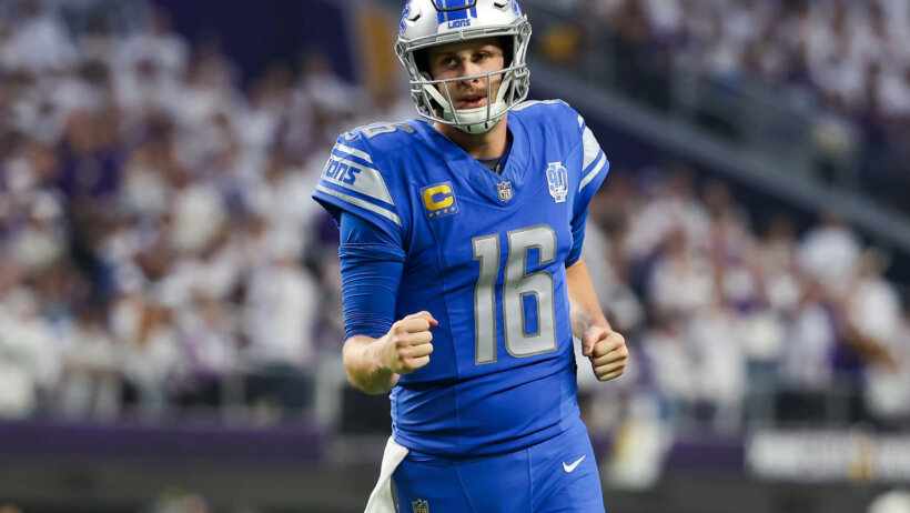 Detroit Lions QB Jared Goff pumping fist blue jersey