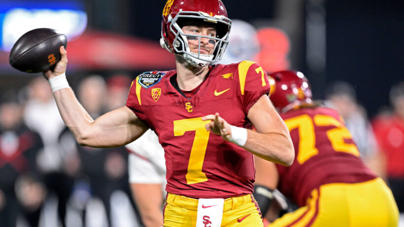 Trojans quarterback Miller Moss throws a pass against the Louisville Cardinals