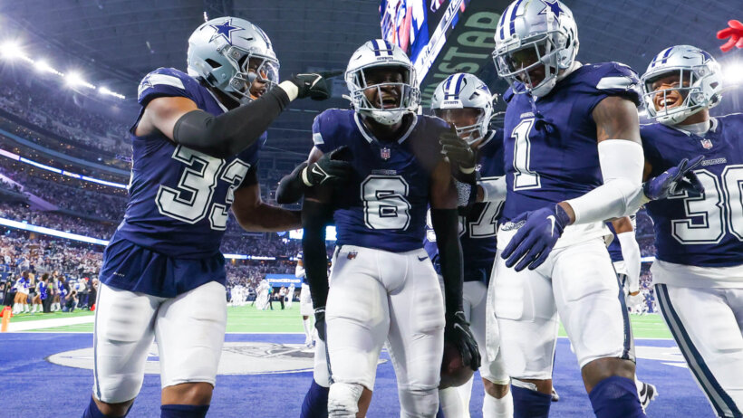 Dallas Cowboys safety Donovan Wilson (6) celebrates with teammates after making an interception