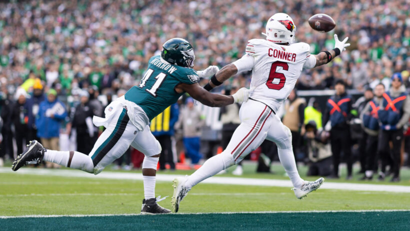 James Connor stretches to catch a pass for the Cardinals