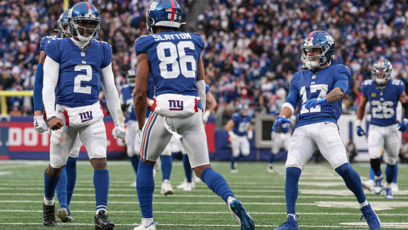 New York Giants wide receiver Darius Slayton (86) celebrates with quarterback Tyrod Taylor (2) and wide receiver Wan'Dale Robinson (17)