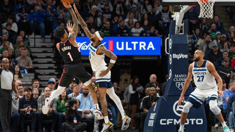 Portland Trail Blazers guard Anfernee Simon shooting a jumper against Minnesota Timberwolves guard Nickeil Alexander-Walker