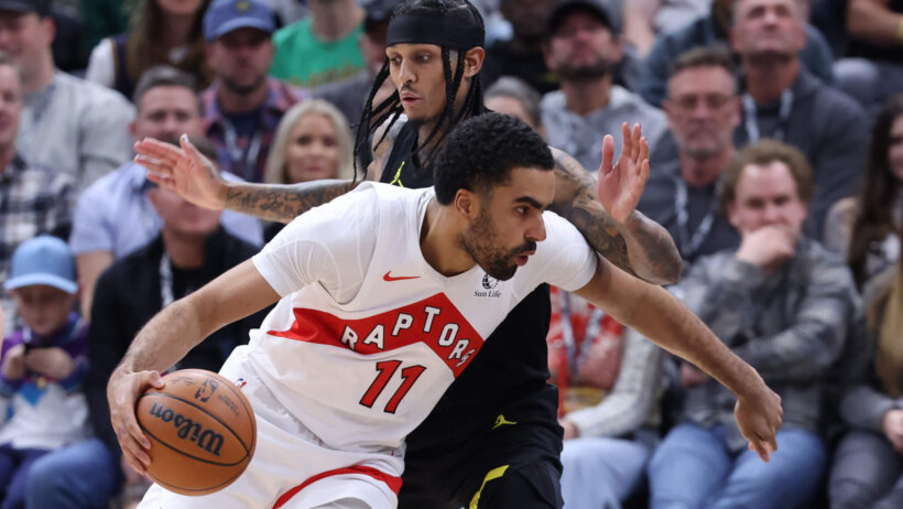 Jan 12, 2024; Salt Lake City, Utah, USA; Toronto Raptors center Jontay Porter (11) drives past Utah Jazz guard Jordan Clarkson (00) during the second quarter at Delta Center.