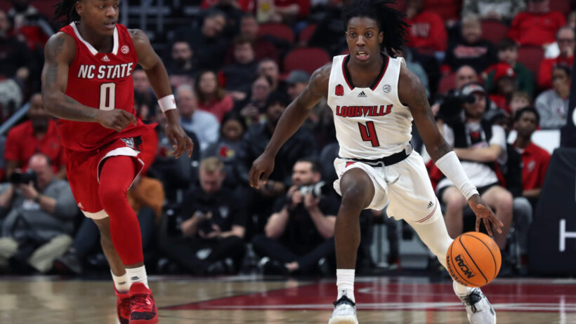 Louisville’s Ty-Laur Johnson dribbles up the court against NC State