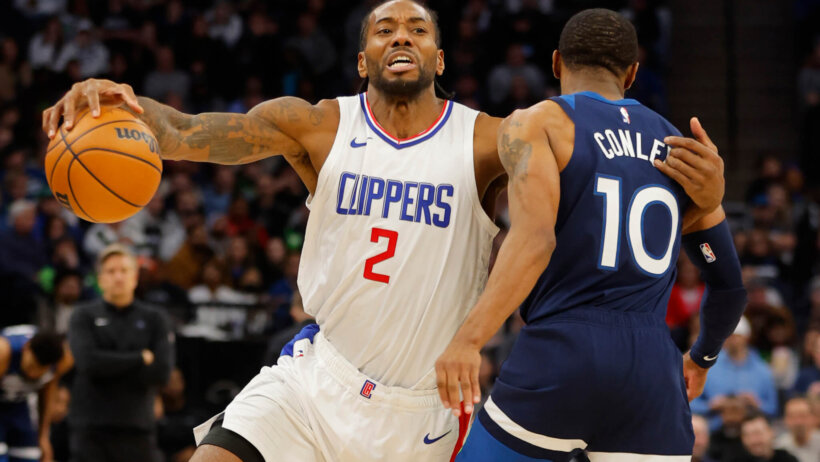 Los Angeles Clippers forward Kawhi Leonard drives past Minnesota Timberwolves guard Mike Conley