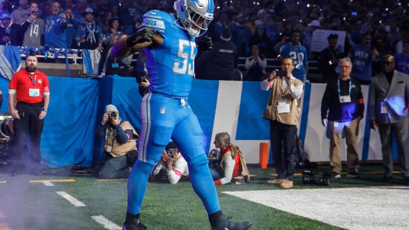 Detroit Lions player Derrick Barnes walking out intro blue jersey