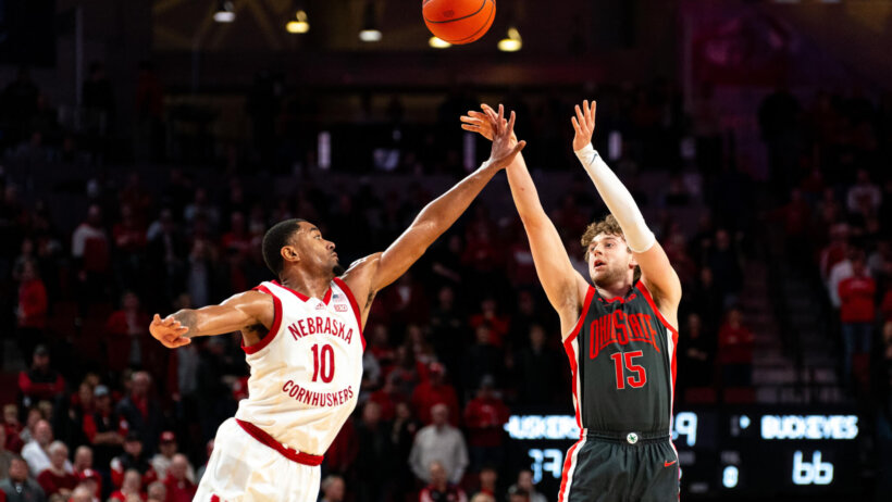 Ohio State Buckeyes guard Bowen Hardman shoots a three over Nebraska Cornhuskers guard Jamarques Lawrence