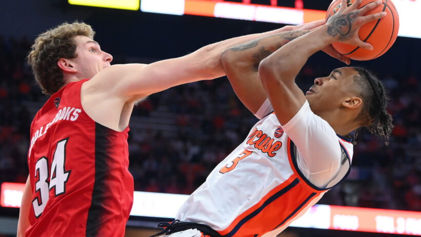 Syracuse Orange guard Judah Mintz shoots as North Carolina State Wolfpack forward Ben Middlebrooks attempts a block