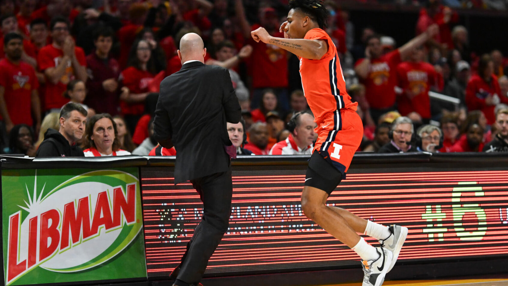 Illinois Fighting Illini guard Terrence Shannon Jr jumping after a loose ball