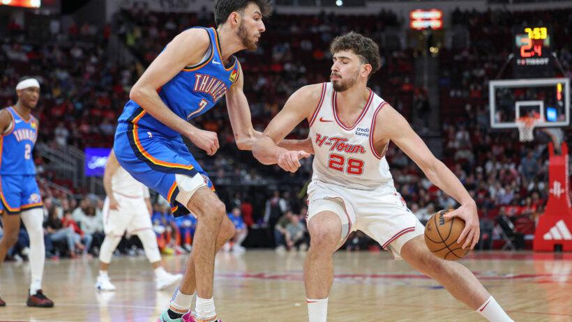 Houston Rockets center Alperen Sengun controls the ball as Oklahoma City Thunder forward Chet Holmgren