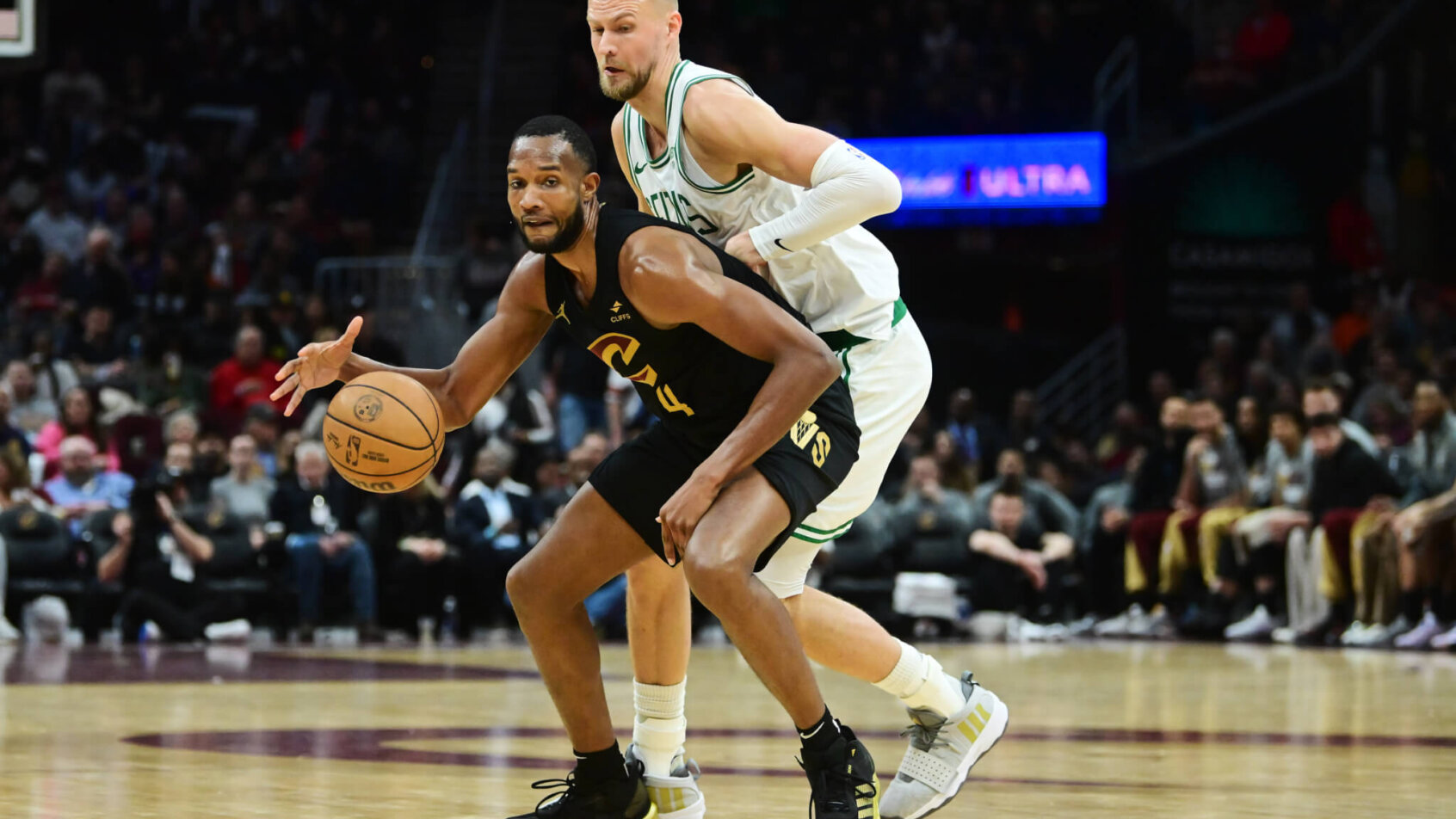 Boston Celtics center Kristaps Porzingis guarding Cleveland Cavaliers forward Evan Mobley