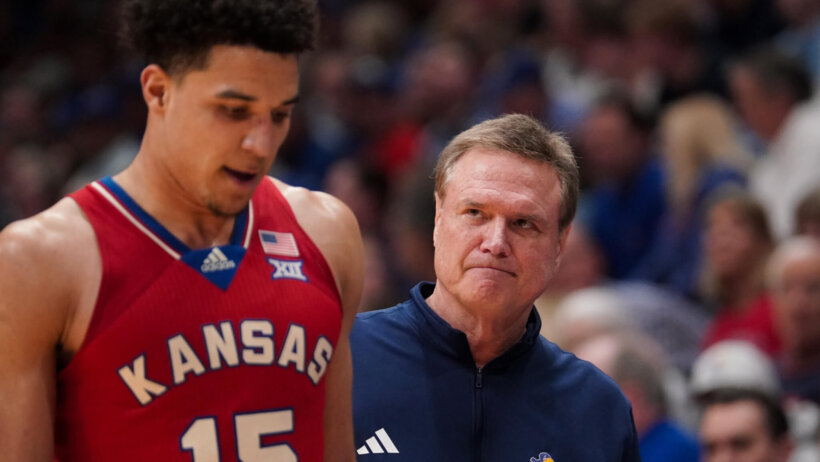 Kansas Jayhawks guard Kevin McCullar Jr and head coach Bill Self