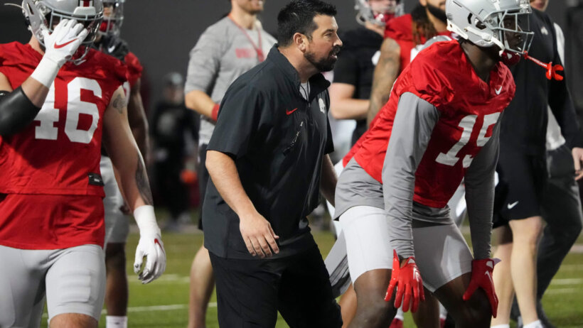 Ohio State Buckeyes head coach Ryan Day workes with players during spring football practice