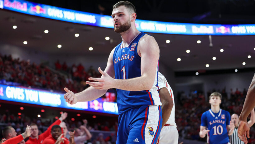 Kansas Jayhawks center Hunter Dickinson looks at an official