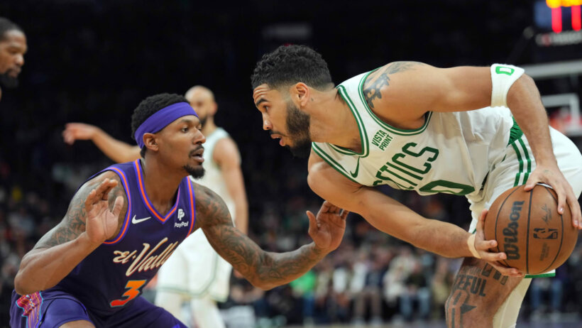 Phoenix Suns guard Bradley Beal guards Boston Celtics forward Jayson Tatum