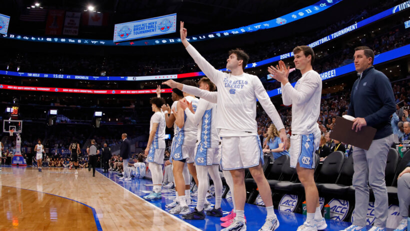 UNC's bench celebrating a three-point field goal