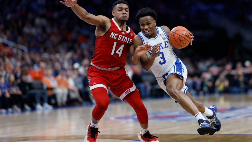 Duke Blue Devils guard Jeremy Roach drives around North Carolina State Wolfpack guard Casey Morsell