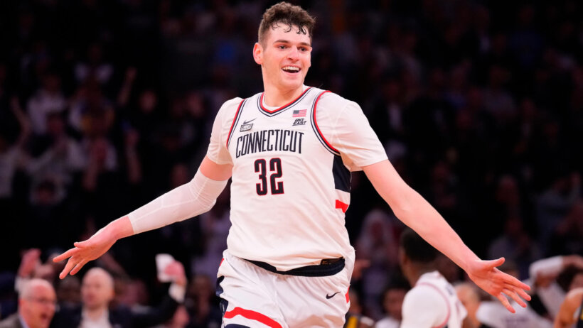 Connecticut Huskies center Donovan Clingan celebrates as the clock winds down
