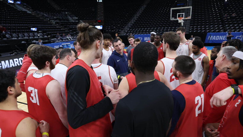 Samford huddling during practice