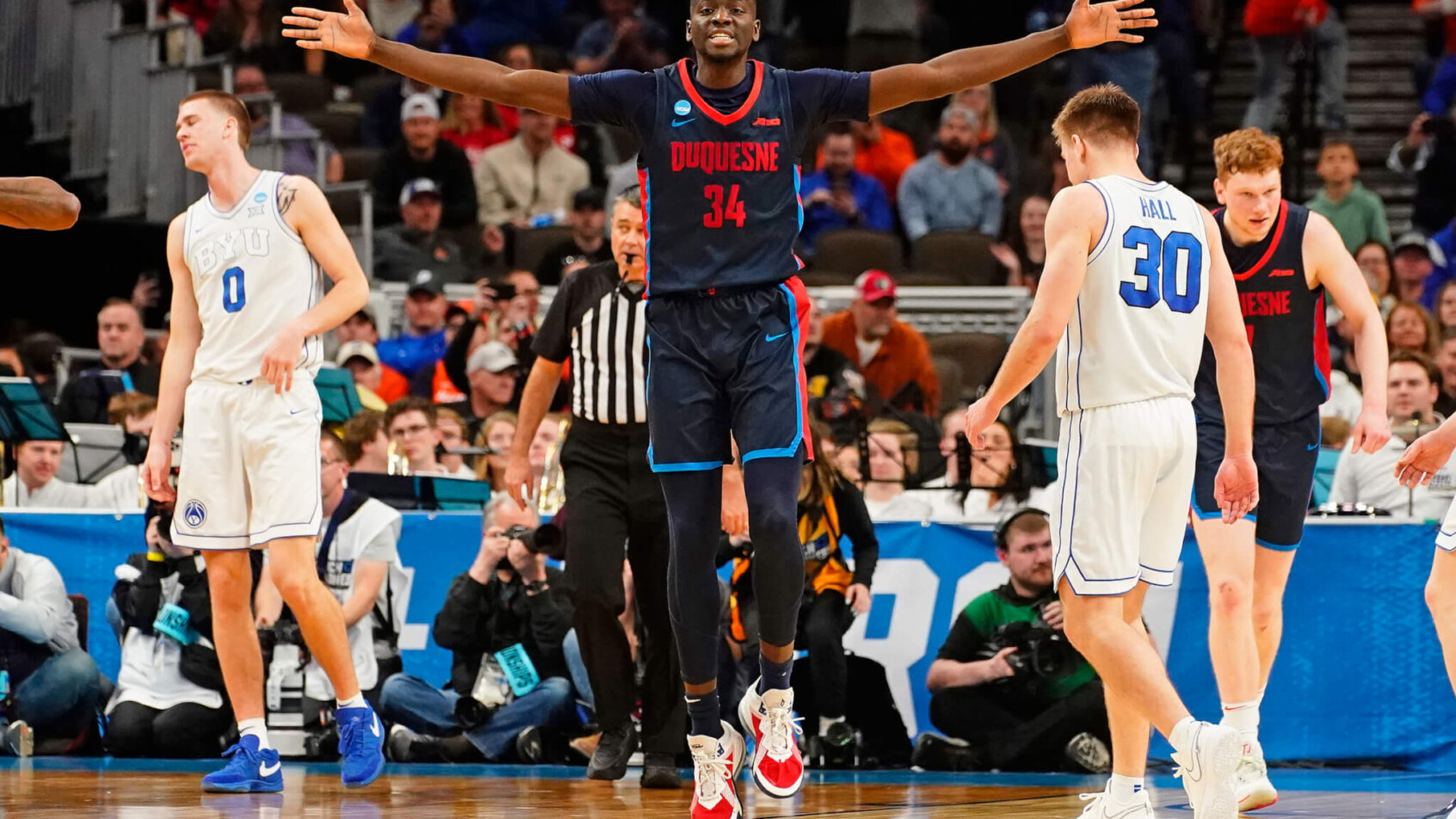Duquesne Dukes forward Fousseyni Drame celebrates a basket