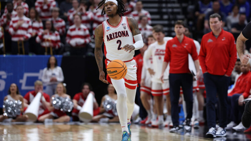 Arizona Wildcats guard Caleb Love dribbling
