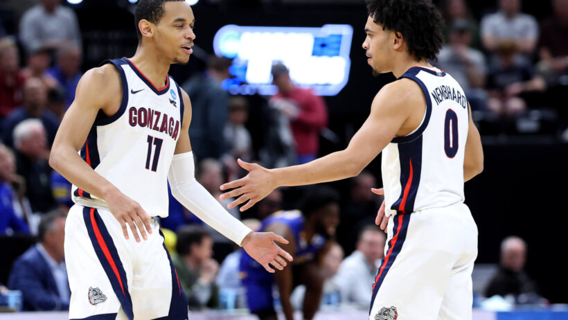 Gonzaga Bulldogs guard Nolan Hickman and Ryan Nembhard high-fiving