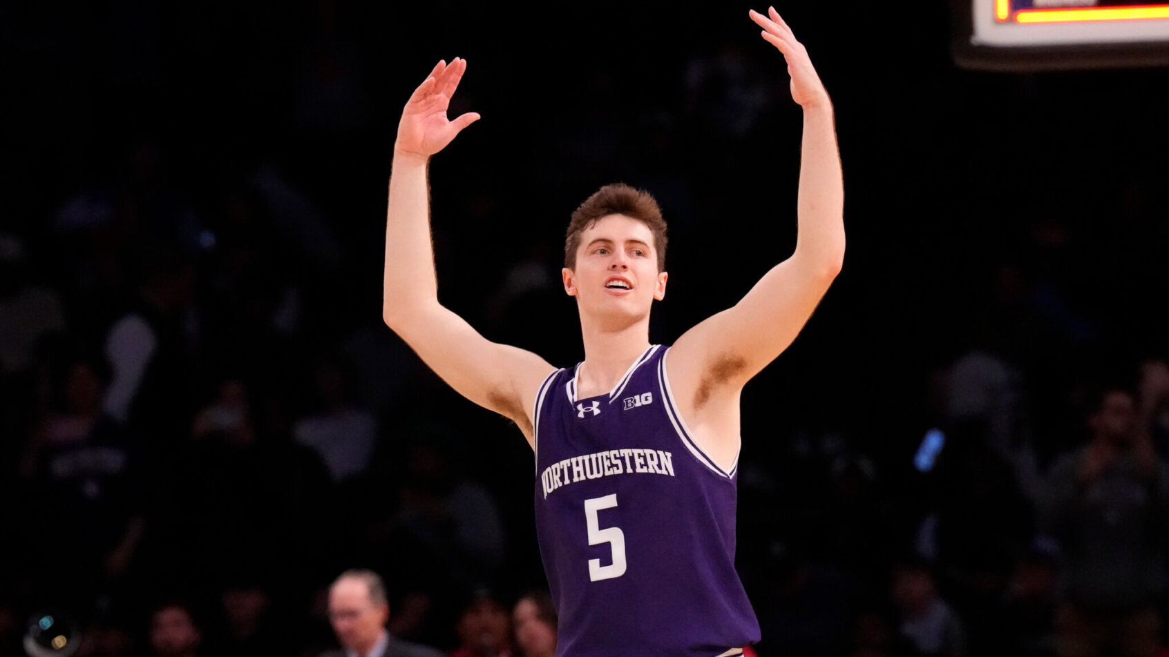 Northwestern Wildcats guard Ryan Langborg celebrates a three