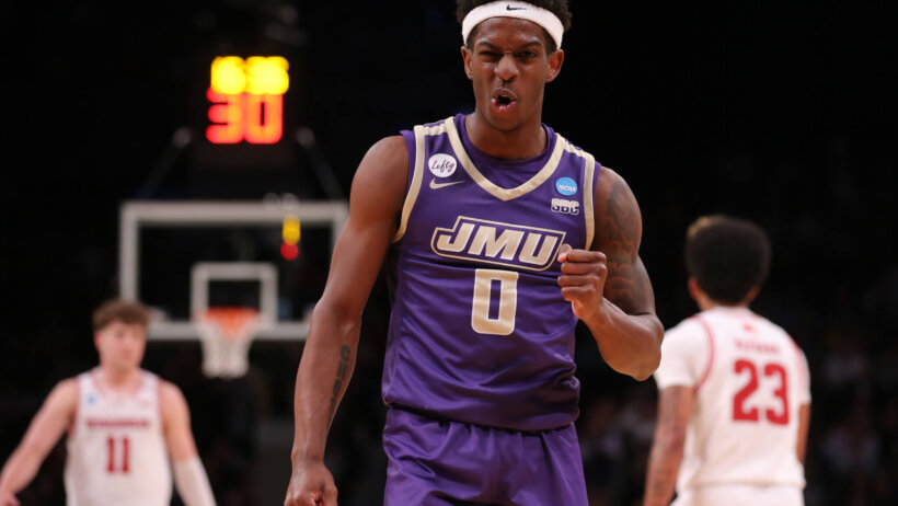 James Madison Dukes guard Xavier Brown fist pumping