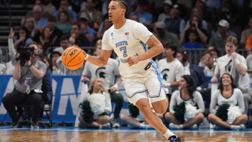 North Carolina Tar Heels guard Seth Trimble dribbles a basketball.