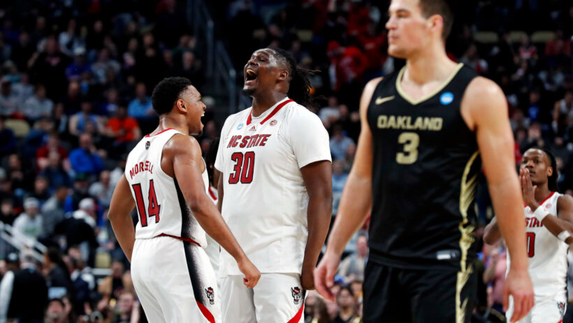 North Carolina State Wolfpack guard Casey Morsell celebrates with forward DJ Burns Jr