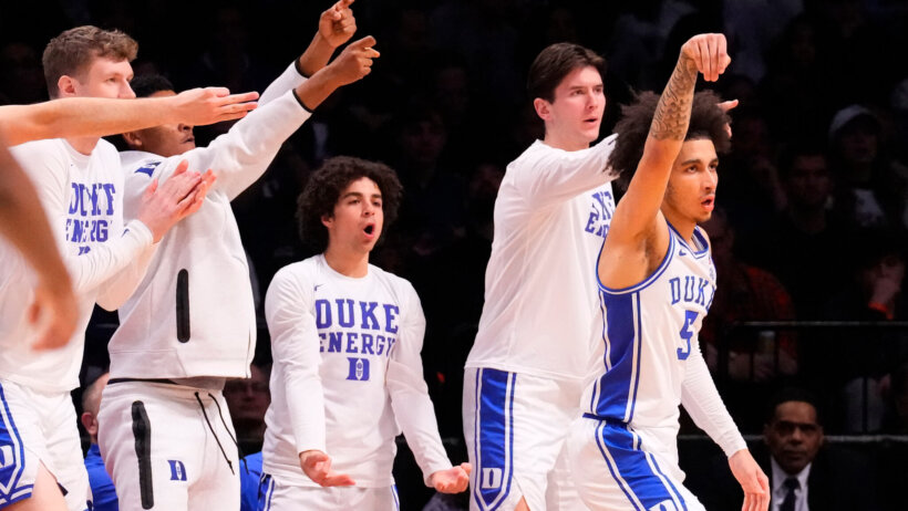 Duke's bench celebrating a three