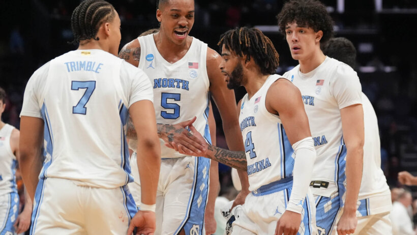 North Carolina Tar Heels players on the floor