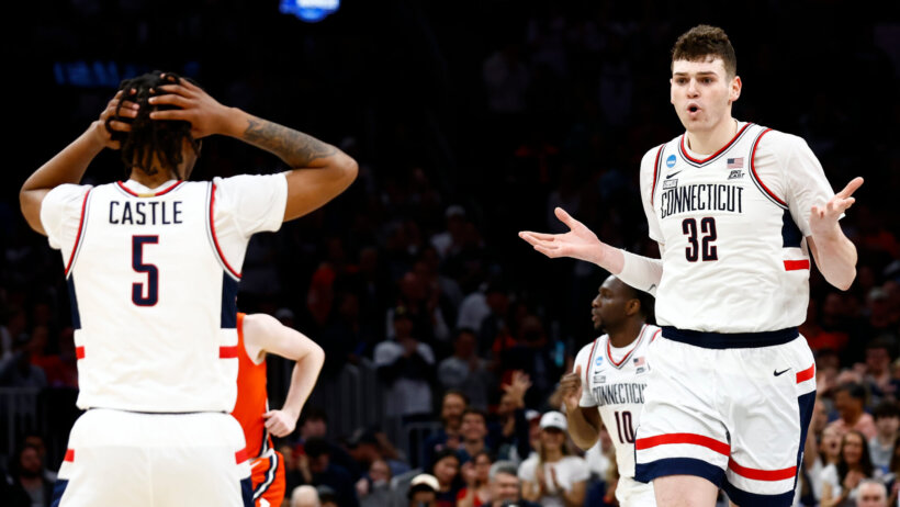 Connecticut Huskies center Donovan Clingan shrugs after scoring a basket