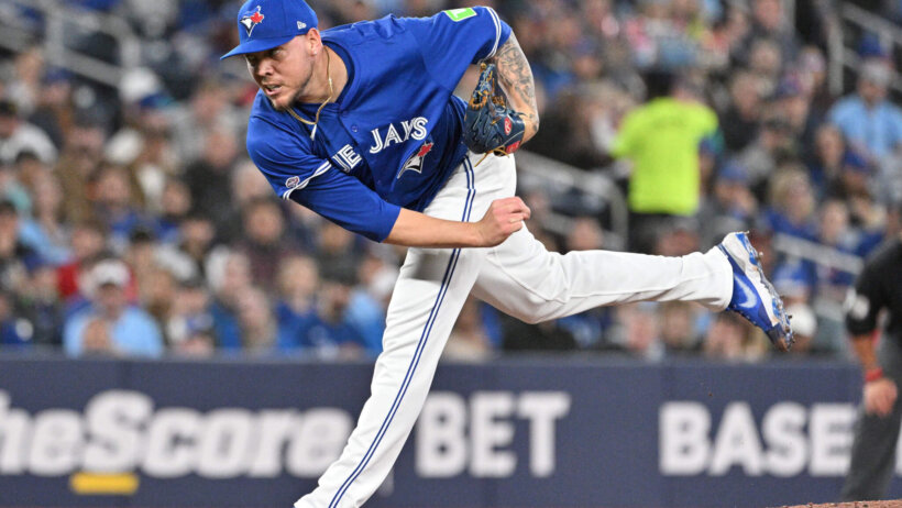 Toronto Blue Jays starting pitcher Yariel Rodriguez delivering to home plate