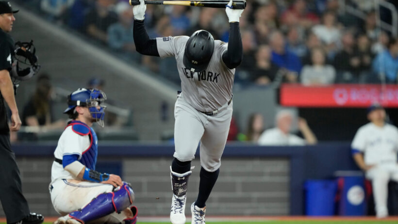 New York Yankees right fielder Juan Soto throws his bat in frustration