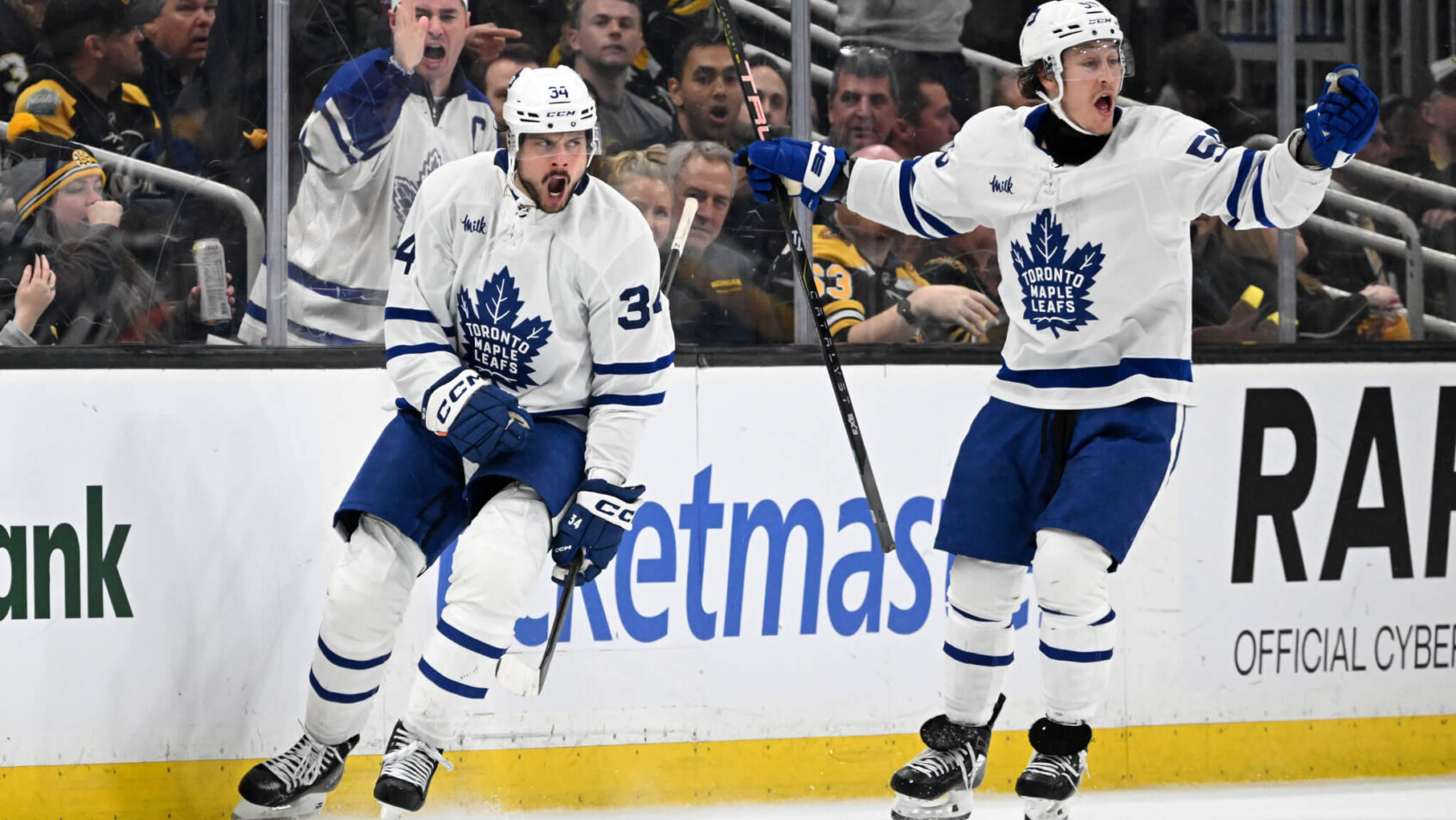 Toronto Maple Leafs center Auston Matthews reacts with left wing Tyler Bertuzzi after scoring a goal against the Boston Bruins