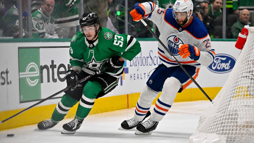 Dallas Stars center Wyatt Johnston and Edmonton Oilers defenseman Darnell Nurse chase the puck