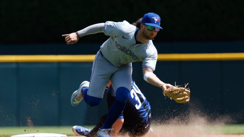 Detroit Tigers catcher Jake Rogers slides into second base as Toronto Blue Jays shortstop Bo Bichette attempts to tag him