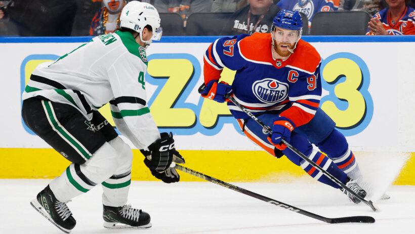 Edmonton Oilers forward Connor McDavid makes a move on Dallas Stars defensemen Miro Heiskanen