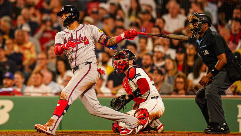 Atlanta Braves shortstop Orlando Arcia hitting a single against the Boston Red Sox