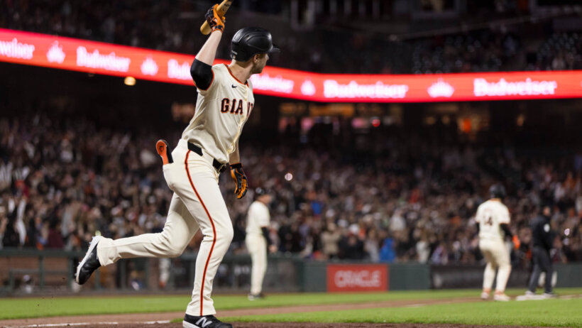 San Francisco Giants pinch hitter Austin Slater running to first after hitting a game-winning single