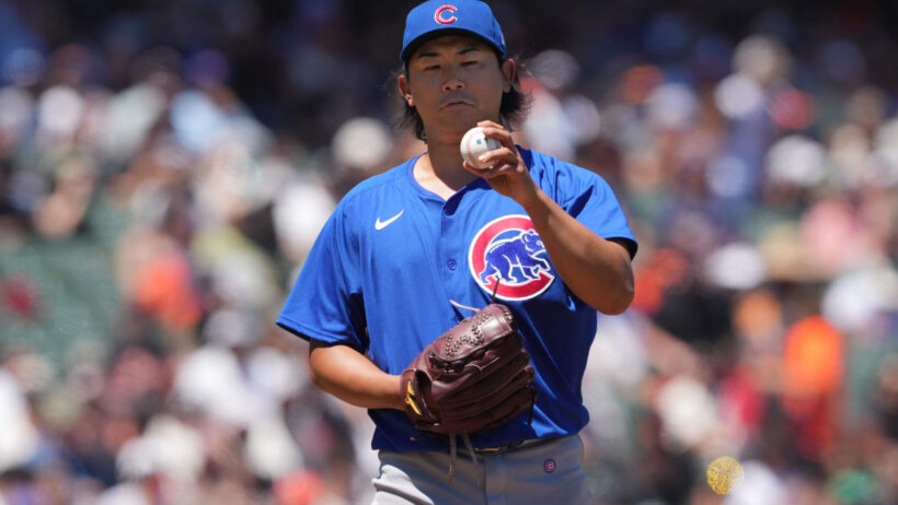 Chicago Cubs starting pitcher Shota Imanaga holding the ball
