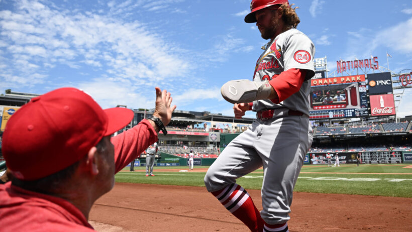 St. Louis Cardinals left fielder Brendan Donovan walks back to the dugout after scoring a run